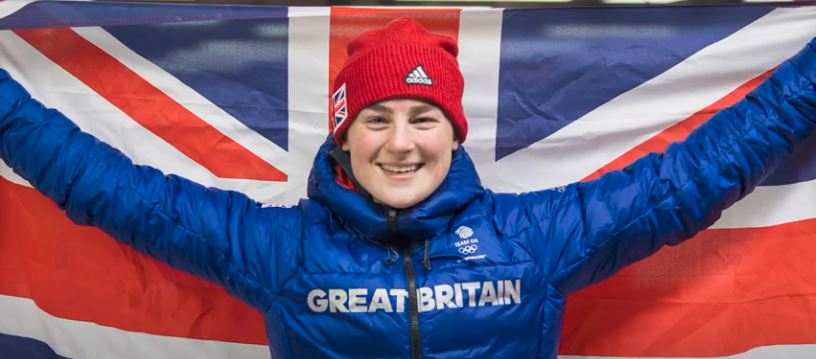 Olympic skeleton medallist, Laura Deas holding up a British flag