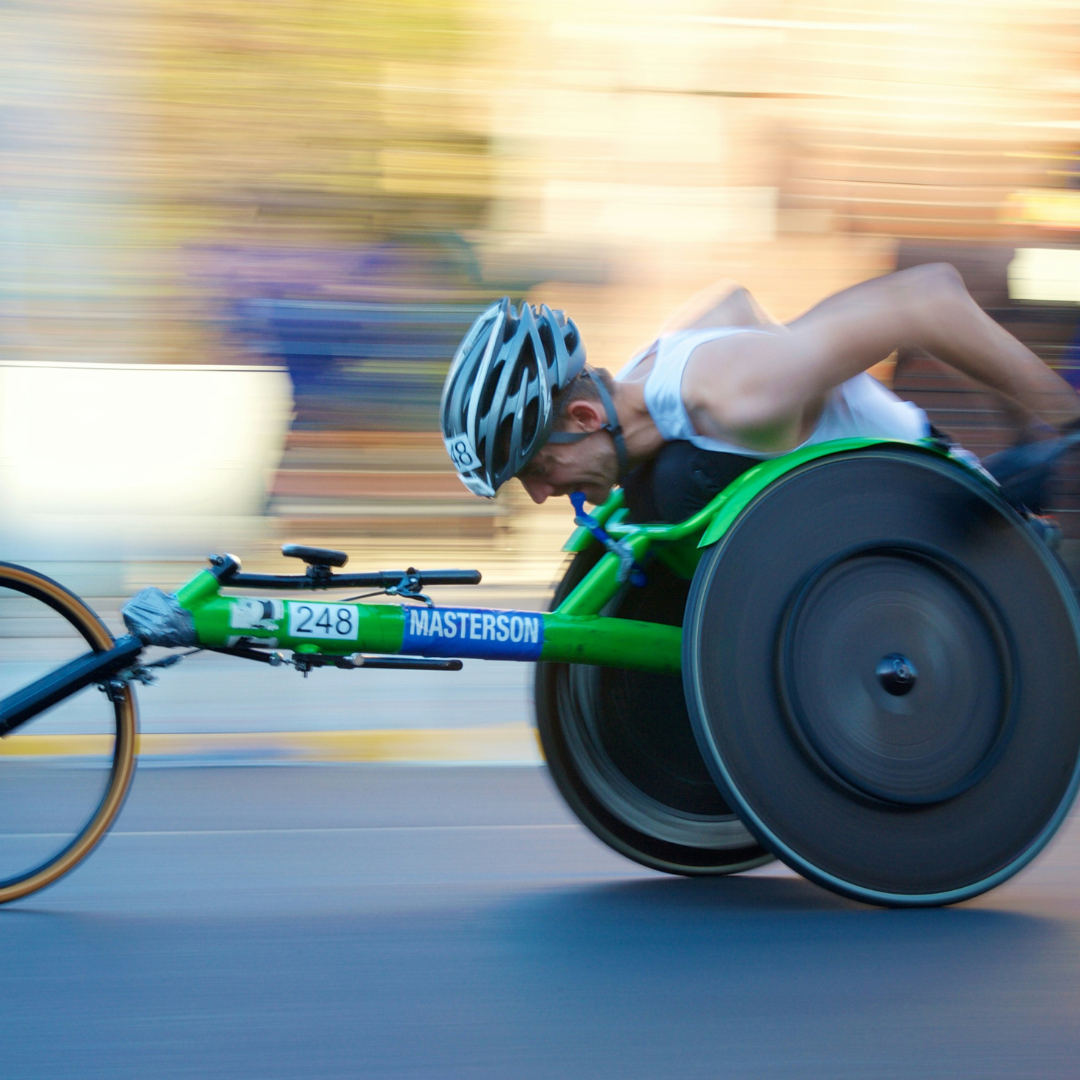 Person competing in marathon wheelchair racing 